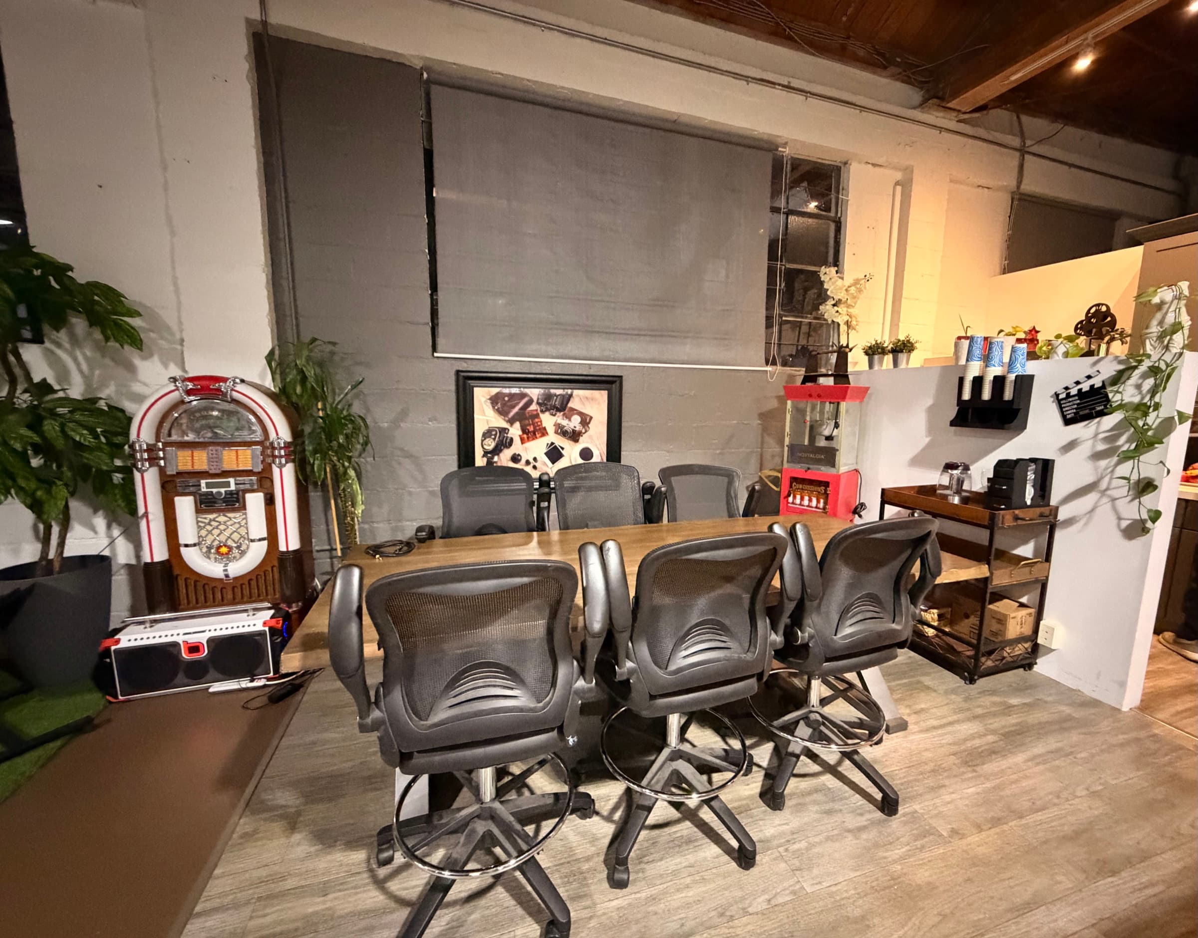 The green room and table-read area with a long work table