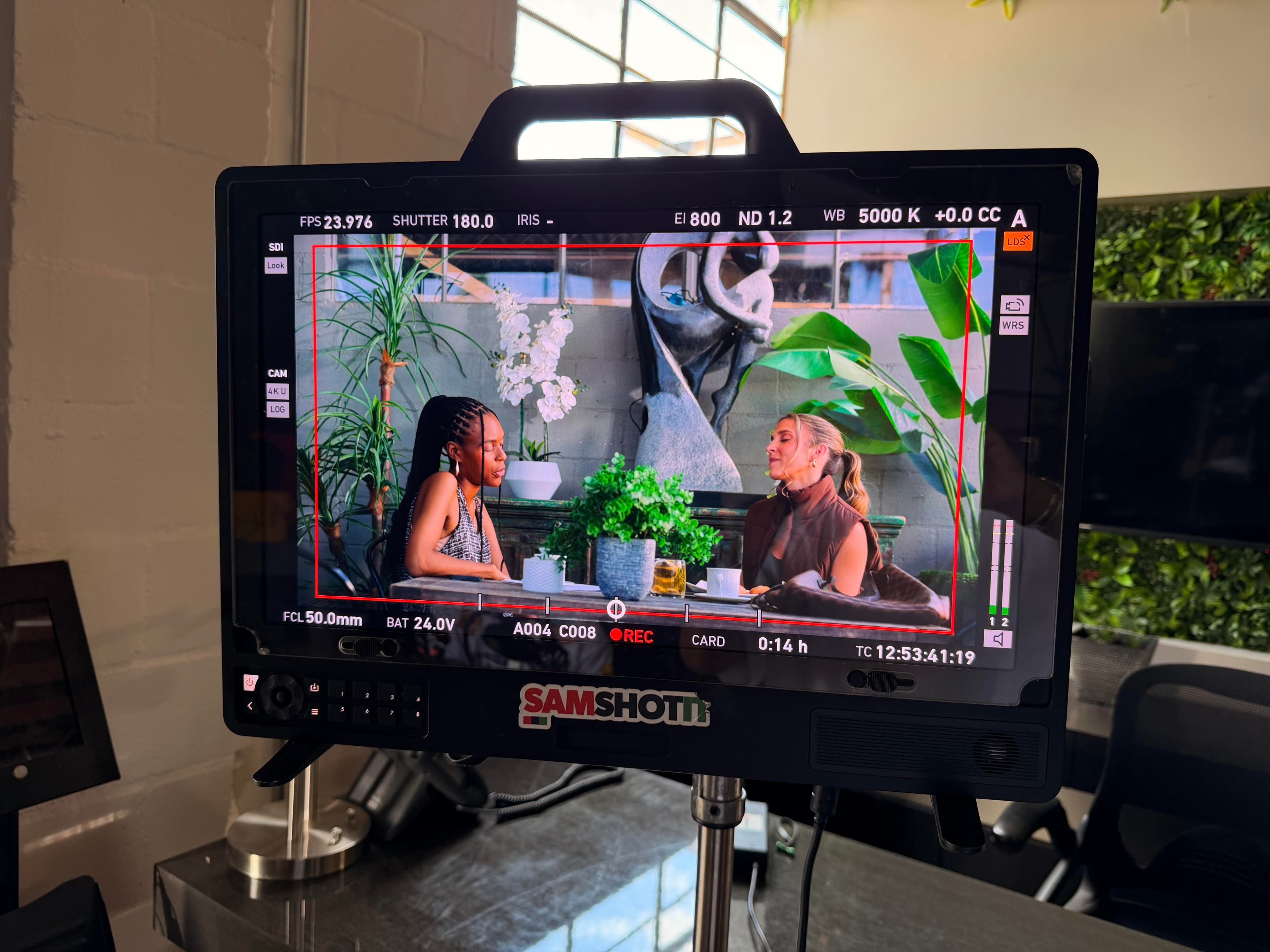Director's monitor framing the patio set scene