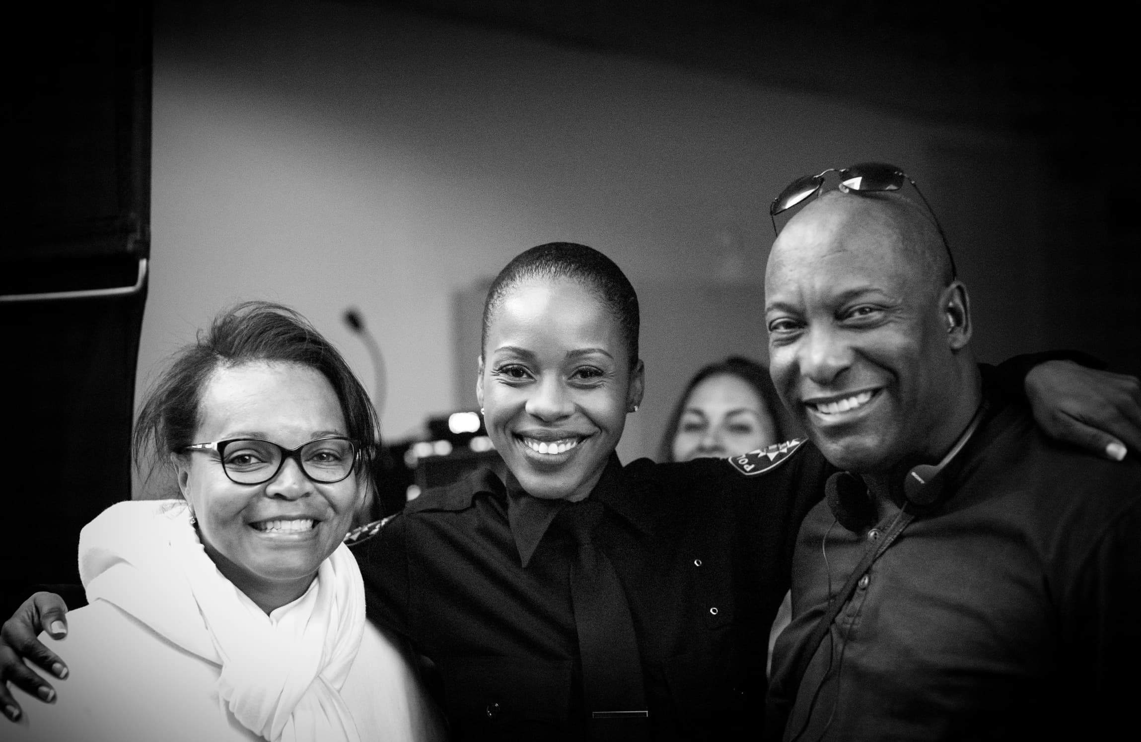 Founder Dion Fearon, actress Danielle Truitt as REBEL, and John Singleton on set